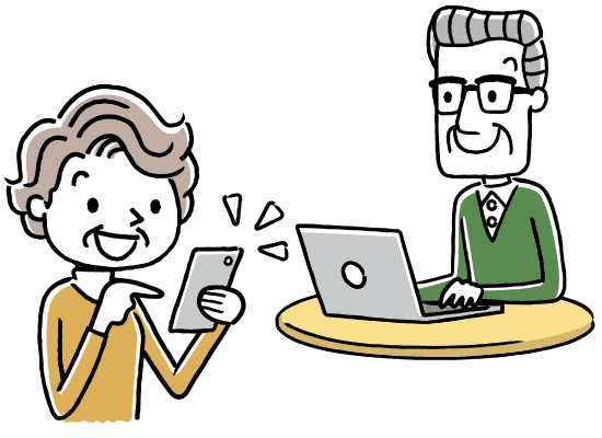 スマートフォンを使用する高齢の女性とパソコンを使用する高齢の男性