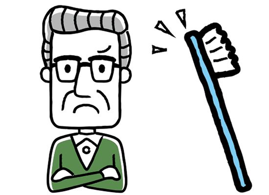 歯ブラシと、腕を組んで嫌そうな表情を浮かべる高齢男性