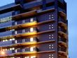 グループホームのイメージ図である。３階建てのブラウンを基調とした大きな建物で、周りに木々が植えられている。