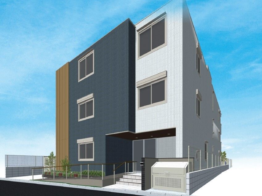 玄関に階段と手すり付きのスロープが付いた3階建ての建物。ダークグレーとライトグレーの外壁。