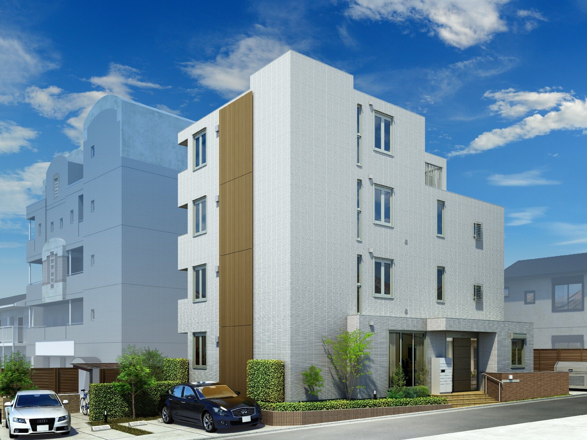 白の4階建ての建物の前には駐車場があり、車が止まっている。玄関には屋根があり、手すり付きのスロープと階段がある。